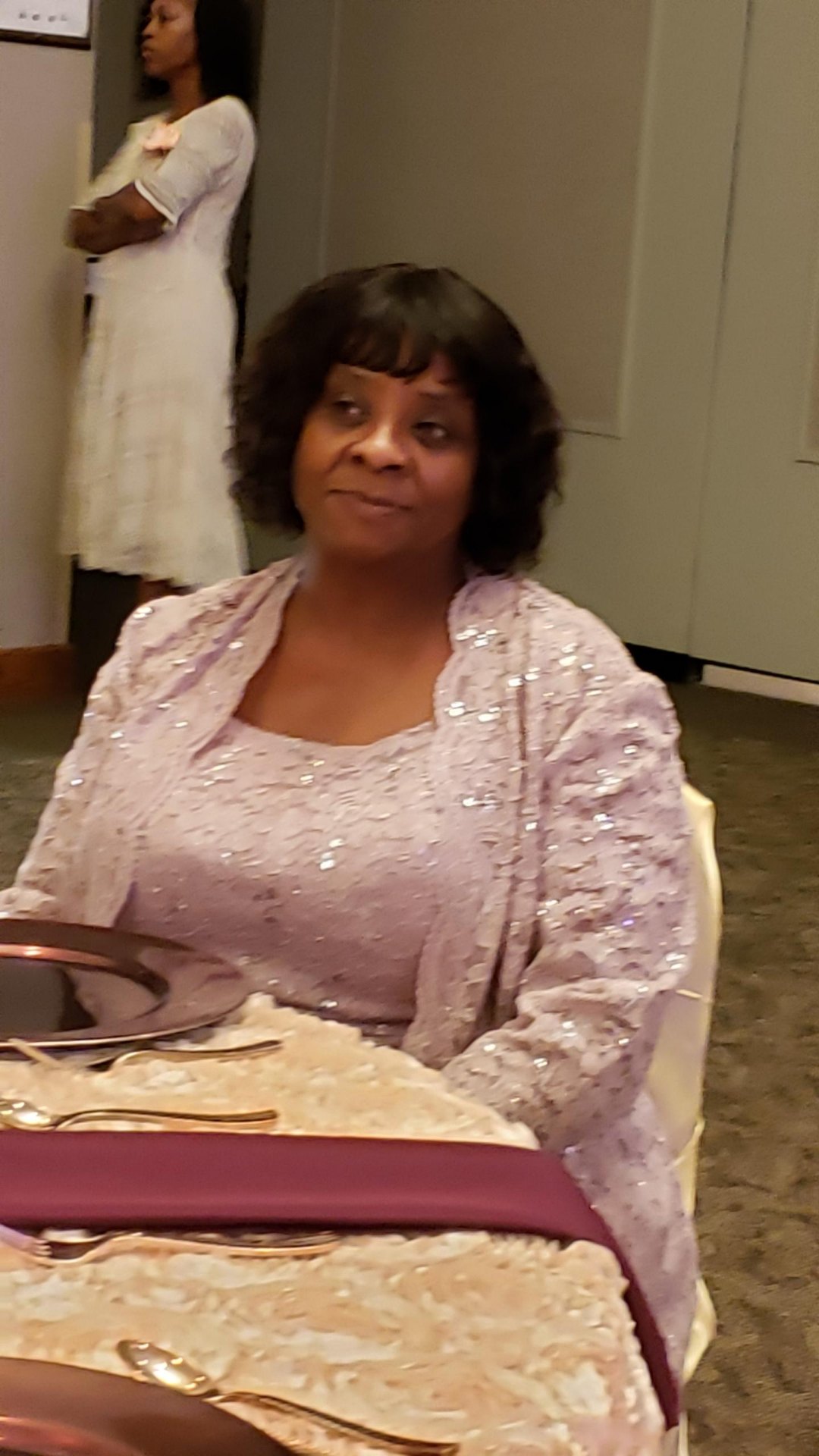Ozell seated at a celebration table